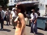 Japanese girl strips naked in crowded area